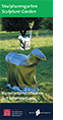 Das Titelbild des Flyers über die Kunstwerke im Skulpturengarten im Außenbereich des Schafhofs - Europäisches Künstlerhaus Oberbayern zeigt die Skluptur "SpaceSheep" des ungarischen Künstlers Csongor Szigeti, ein silbernes, halb abstraktes Schaf auf einer Wiese.