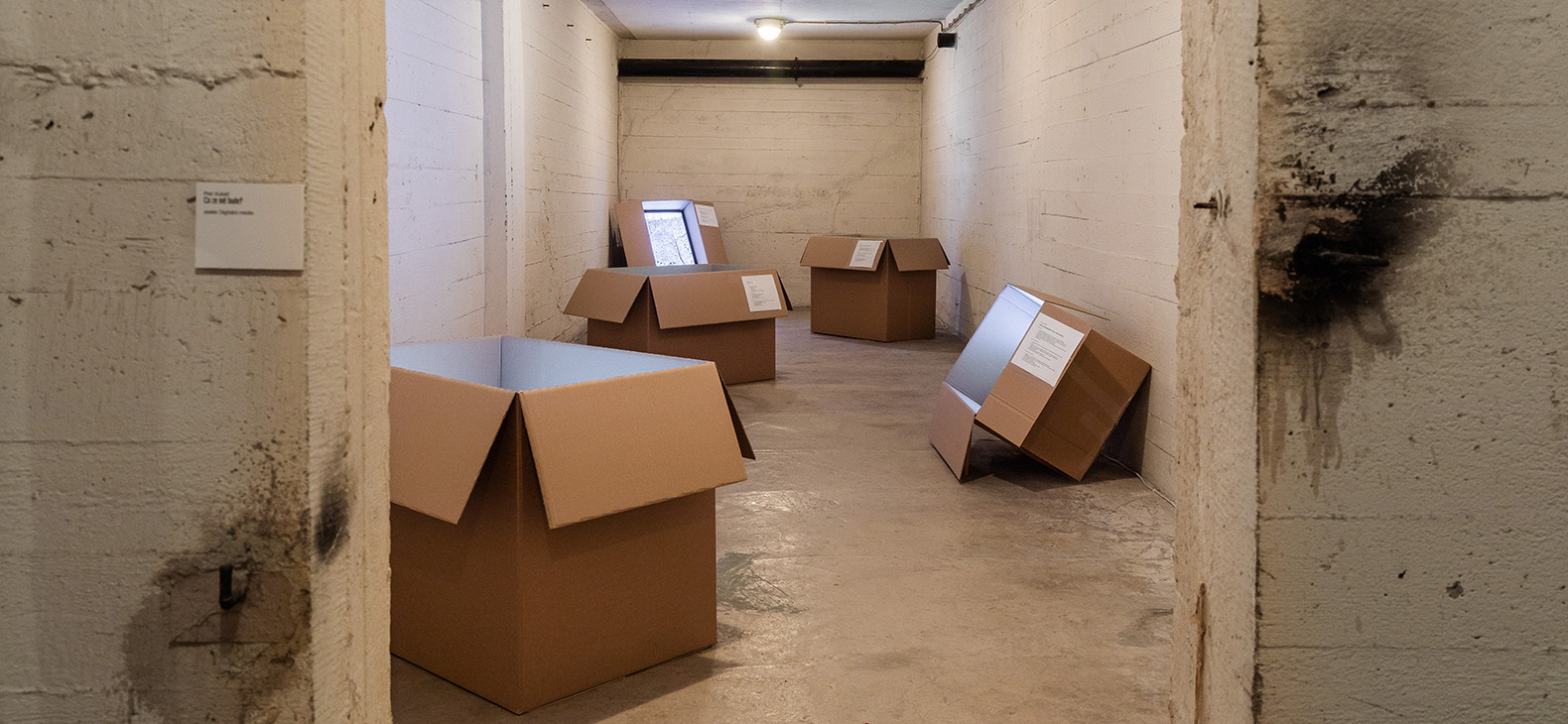 Artist-in-Residence: Petr Kubáč; Focus > Usti nad Labem, stay at Schafhof August - September 2023: Image: Petr Kubáč - When grow up, 2023. A view of an installation of cardboard boxes with monitors inside in a room of an abandoned building.