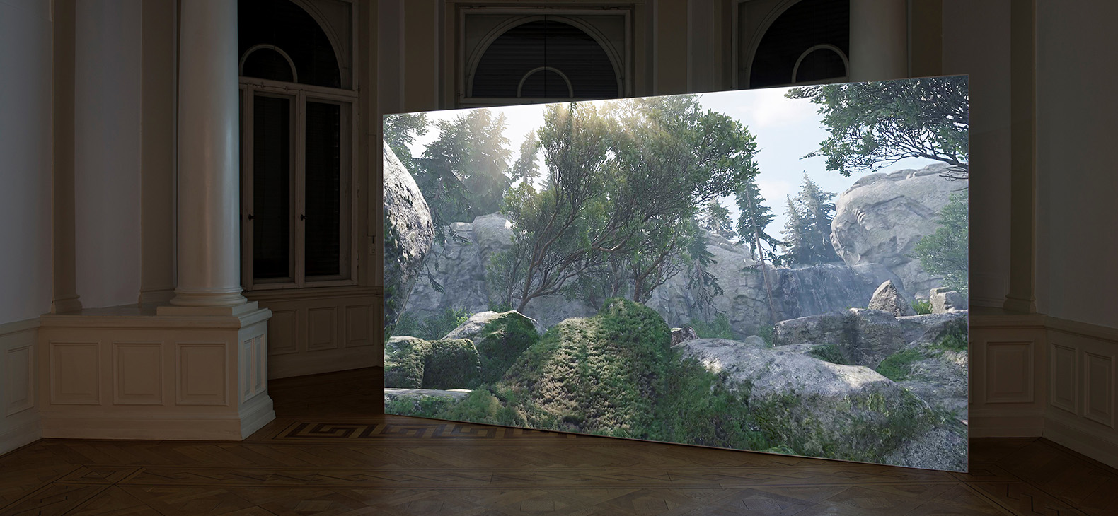 Barbara Herold and Florian Huth: The picture shows a canvas in a room. A computer-generated landscape by Barbara Herold and Florian Huth can be seen on the canvas. The landscape consists of many stones. The sun shines through the crown of a tree at the top center of the picture.